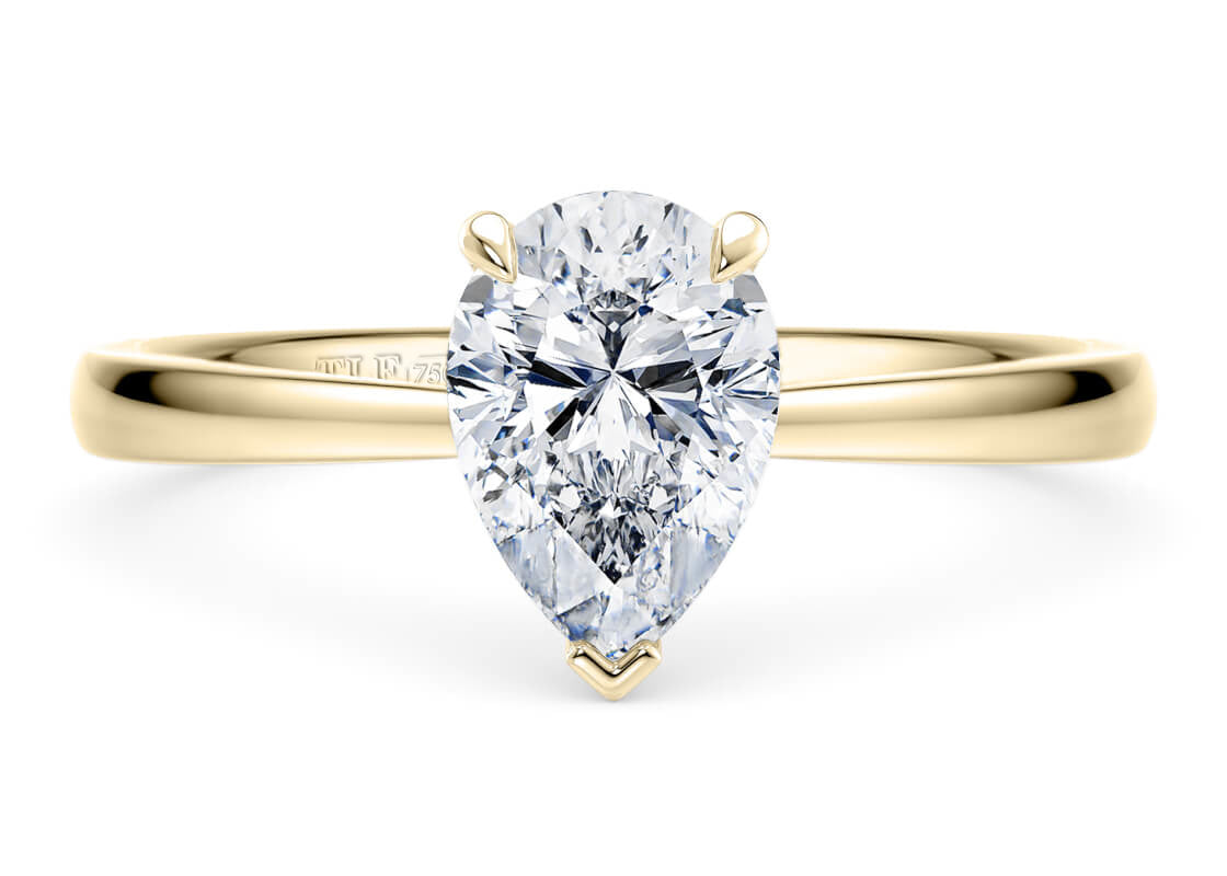 Pear Cut Solitaire Engagement Ring Quad Claw Set