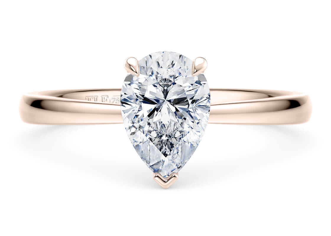 Pear Cut Solitaire Engagement Ring Quad Claw Set